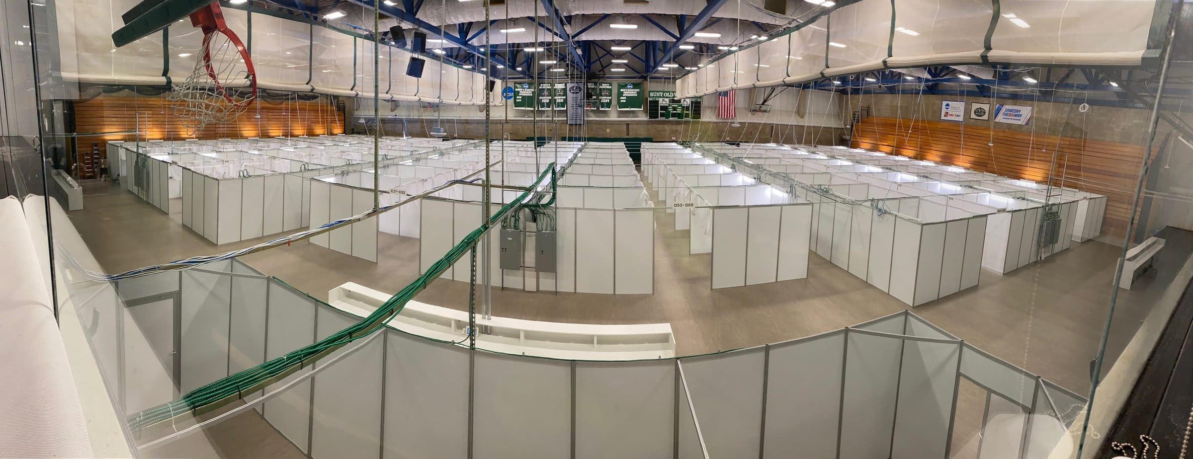 Panorama of the gymnasium converted to patient care cubicles